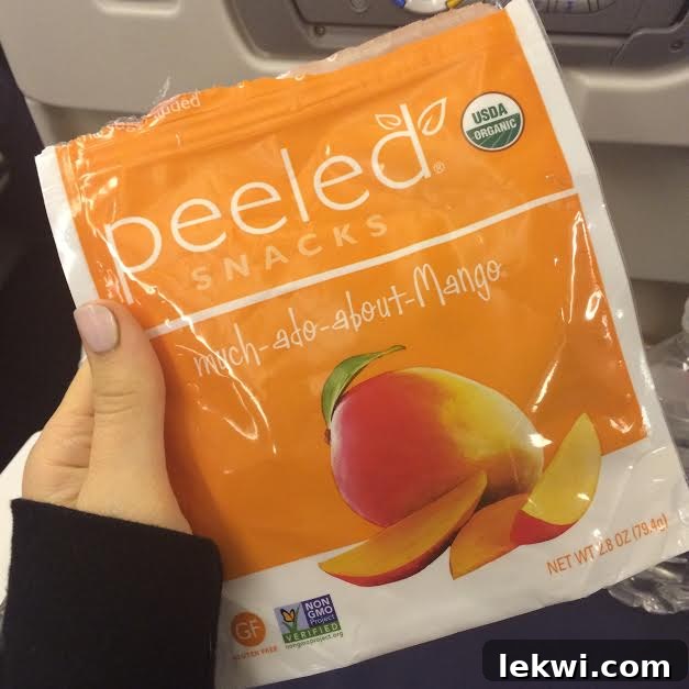 A close-up of a bag of dried mango slices.