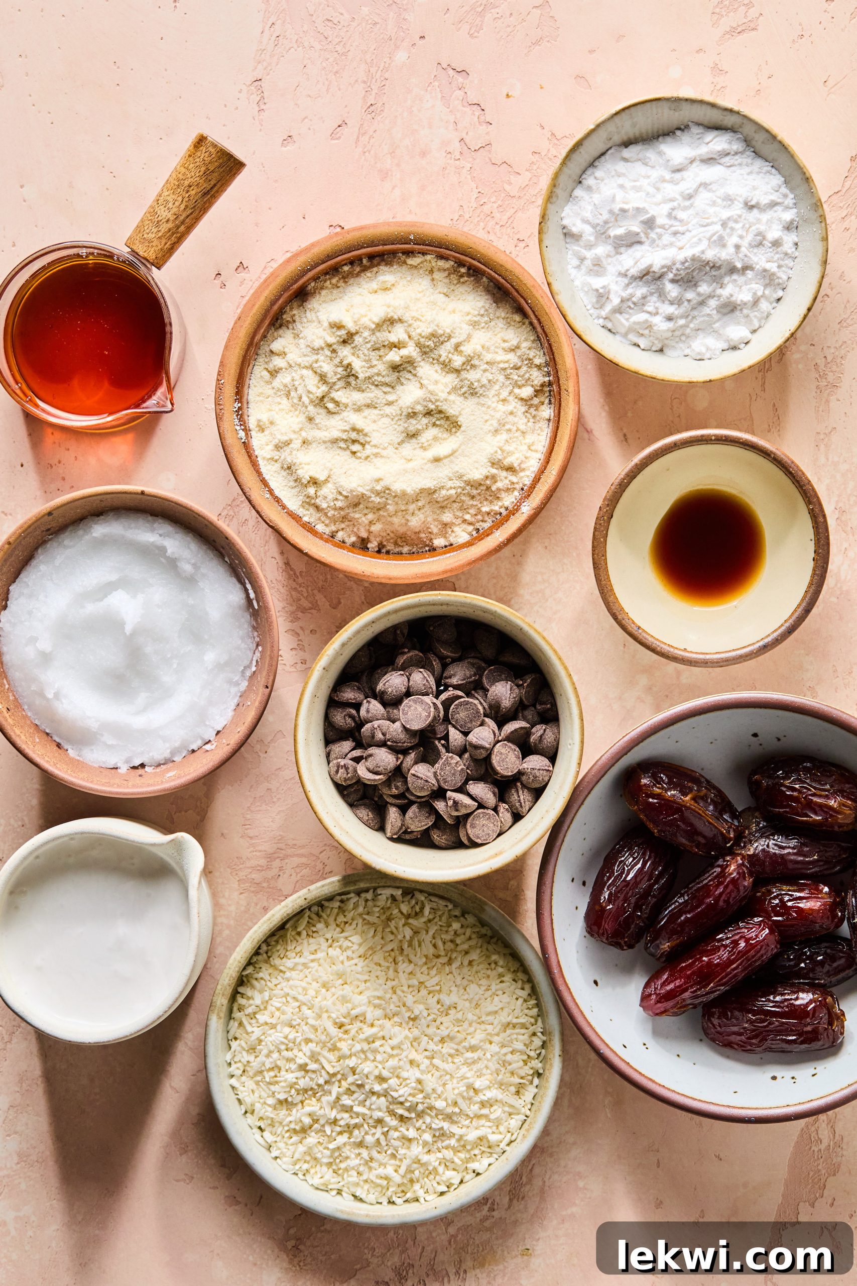 All the essential ingredients for making Samoa cookies, neatly arranged in separate bowls on a kitchen counter, ready for preparation.