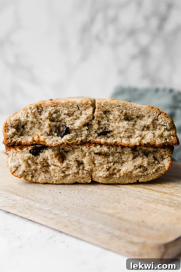 Two slices of Irish soda bread on top of two other slices of Irish soda bread.
