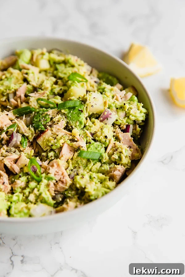 Avocado tuna salad served in a bowl with sweet potato toast.