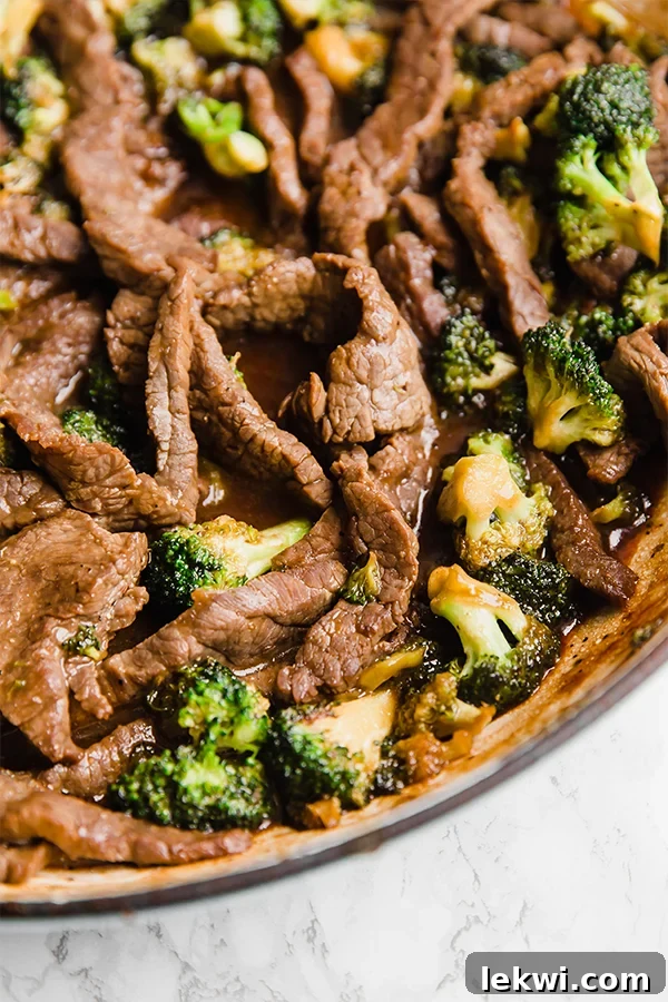 Close-up of vibrant beef and broccoli stir-fry in a pan