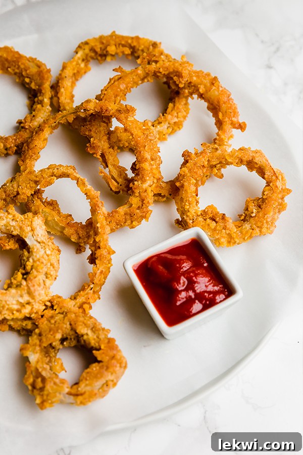 Crispy baked onion rings on a plate