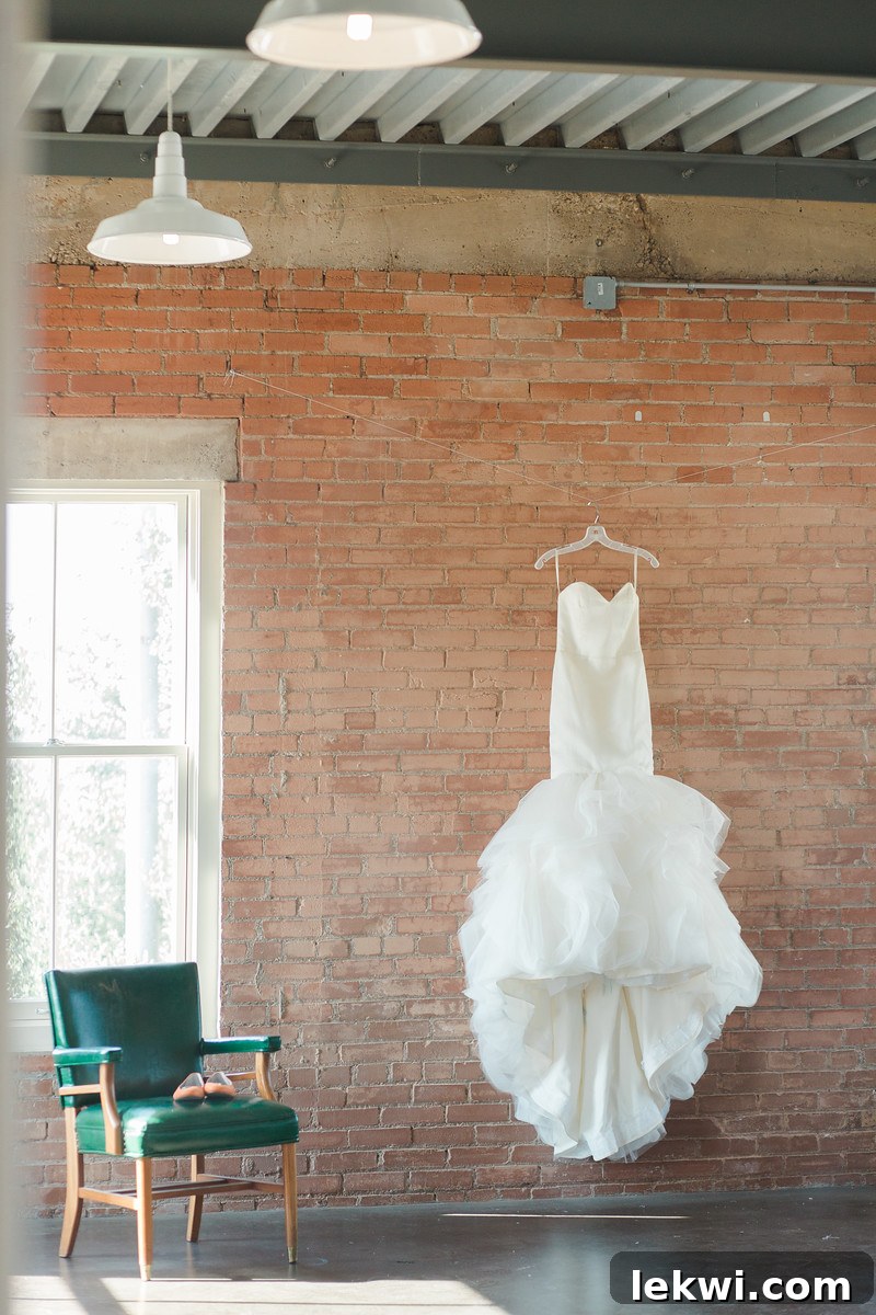 Bride in her Alvina Valenta mermaid wedding dress, smiling.