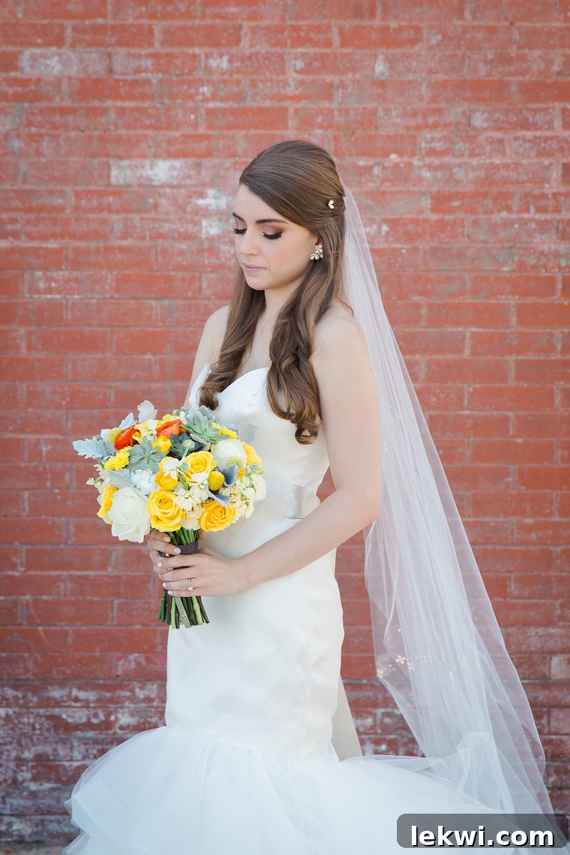 Close-up of the bride's wedding dress details and bouquet.