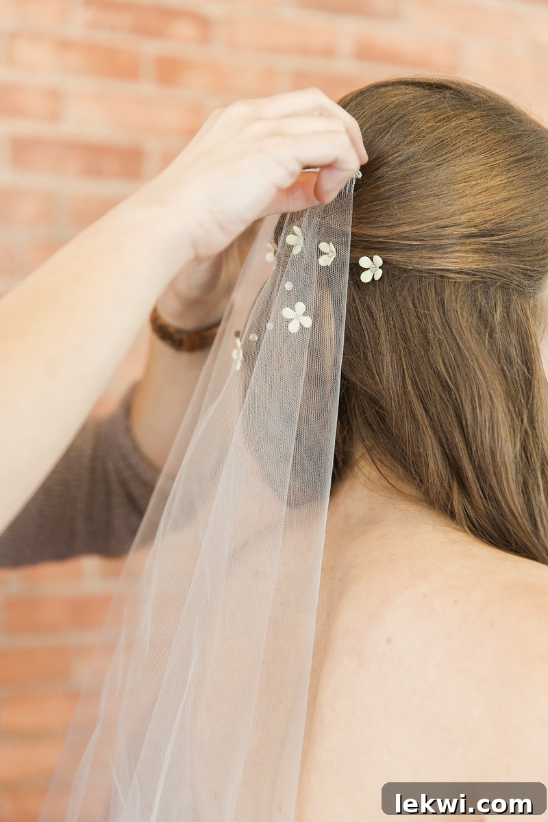 Bride wearing her custom-painted yellow veil and accessories.