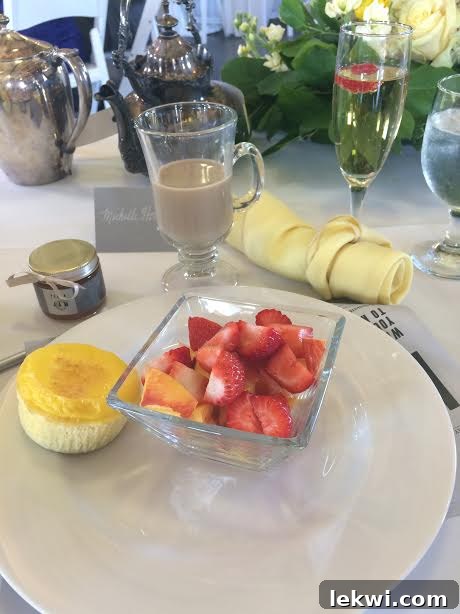 A personal plate of fruit, eggs, and coffee for an AIP-friendly wedding meal.