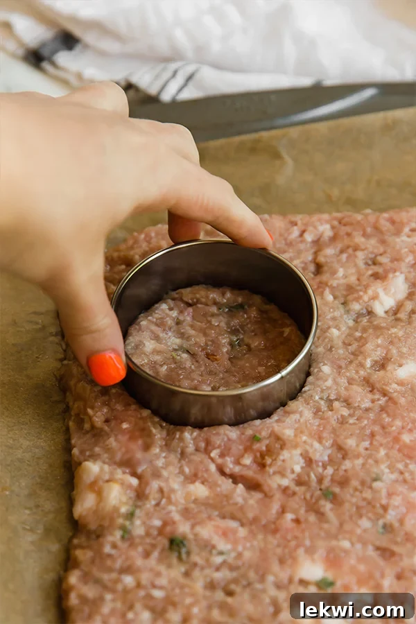 Close-up of raw breakfast sausage patties ready for cooking, ideal for a homemade paleo and AIP breakfast.