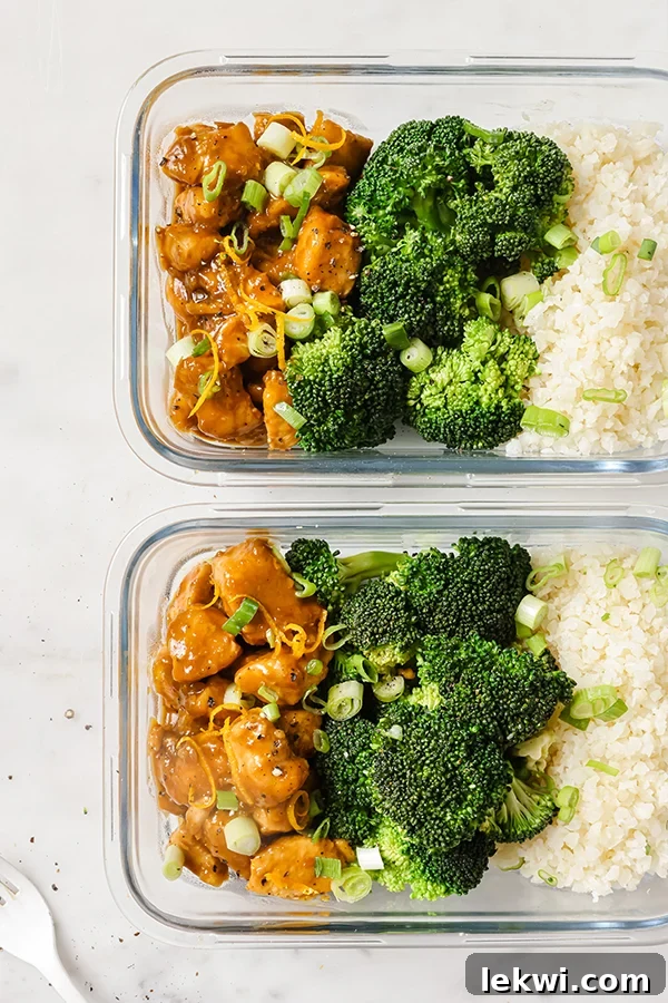 Glass meal prep containers filled with gluten-free orange chicken, steamed broccoli, and cauliflower rice for healthy weekly lunches.