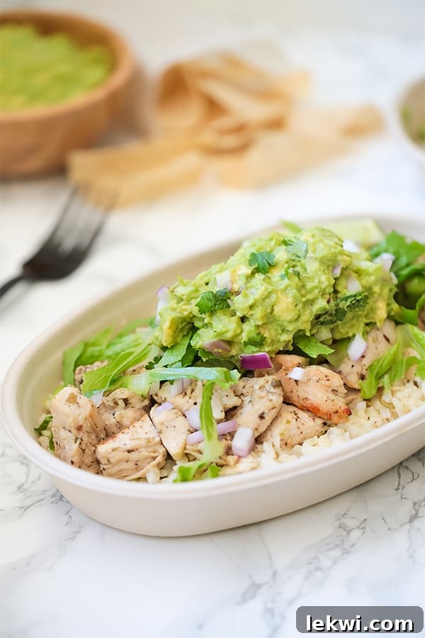 A vibrant and generously portioned Copycat Chipotle Chicken Burrito Bowl, perfectly crafted to be Whole30, Paleo, and AIP compliant.