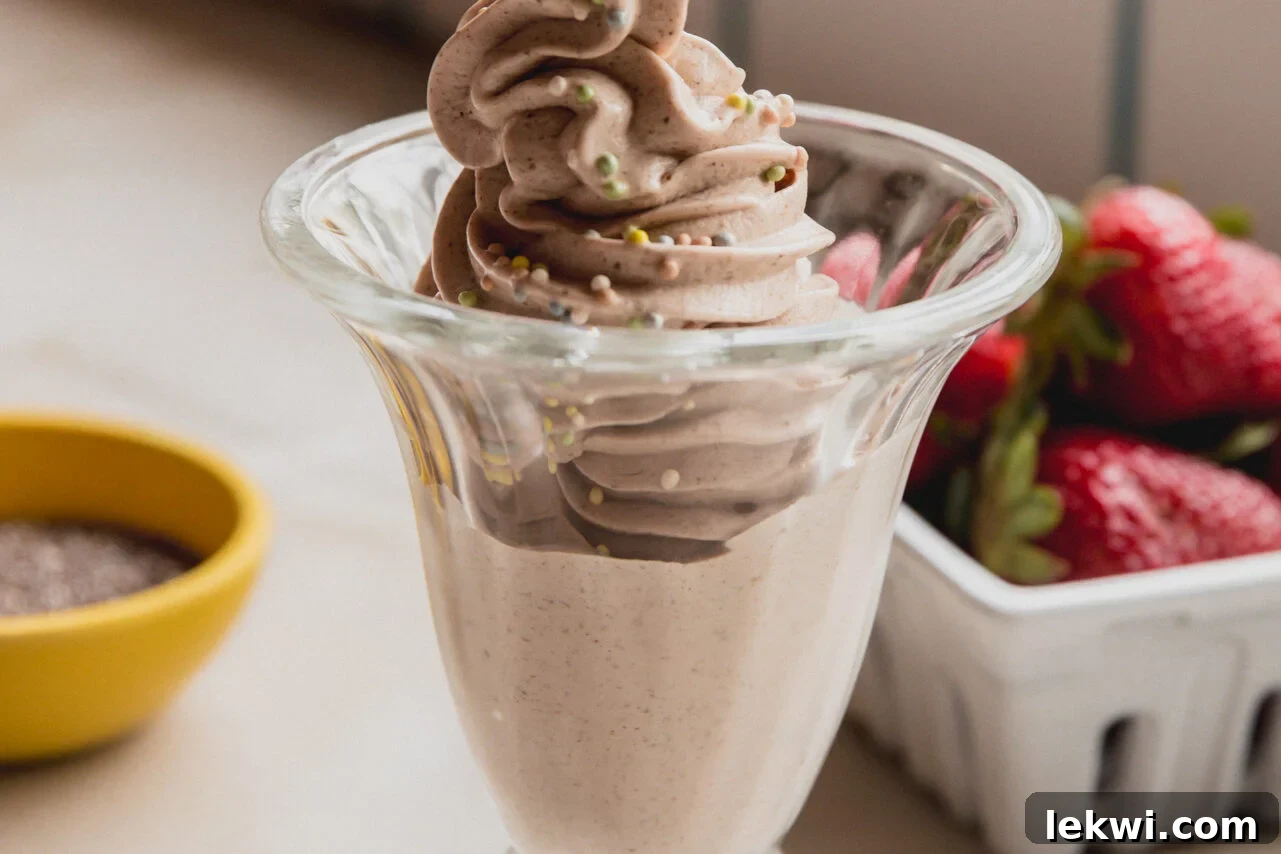 The chia seed ice cream in a glass bowl topped with sprinkles.