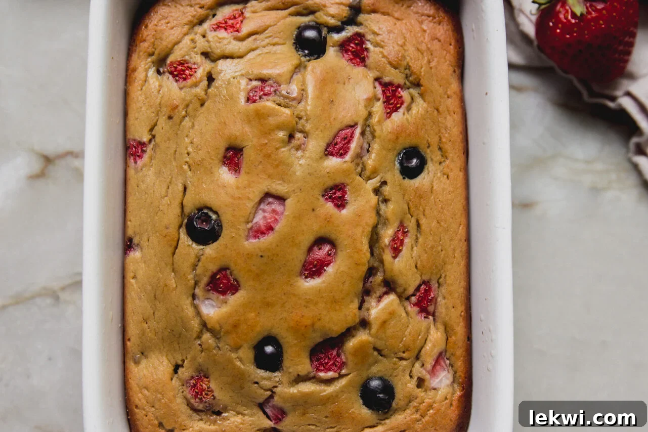 Berry Protein Breakfast Cake: High-Protein Morning Berries Bake 8 Berry protein breakfast cake in a small ceramic baking dish.