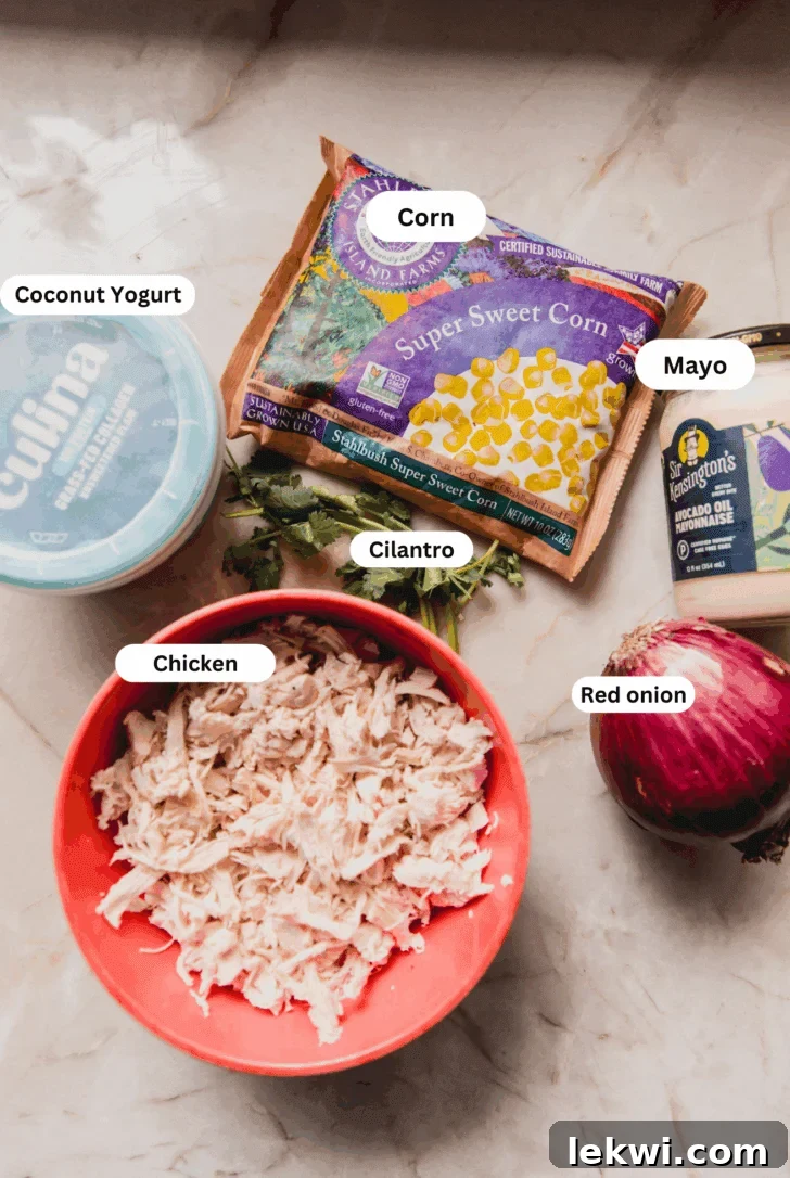All the ingredients for making street corn chicken salad laid out on a counter before cooking.