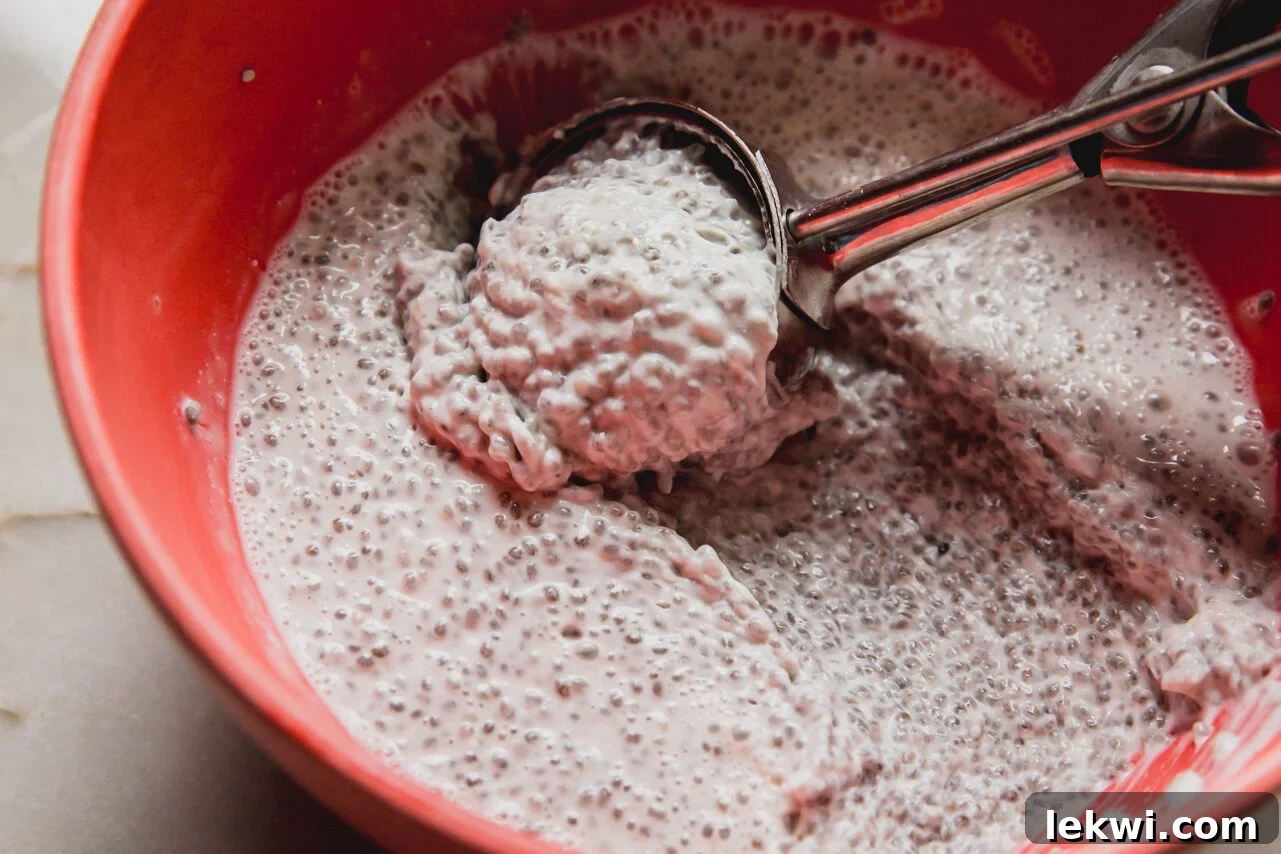 Gluten-Free Protein Tiramisu Recipe: High-Protein Dessert Without Gluten 4 A red bowl filled with chia seed mixture after solidifying in the fridge.
