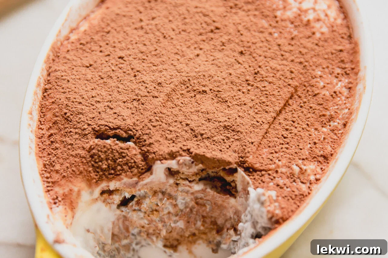 Gluten-Free Protein Tiramisu Recipe: High-Protein Dessert Without Gluten 8 Protein tiramisu in a small yellow dish.