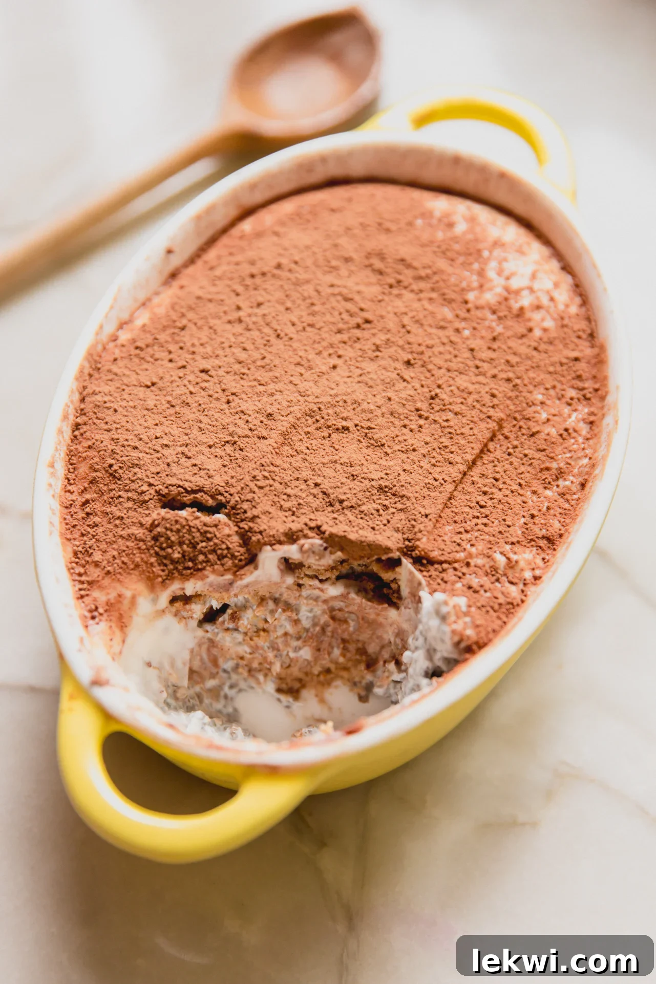 Gluten-Free Protein Tiramisu Recipe: High-Protein Dessert Without Gluten 9 Protein tiramisu in a small yellow dish.