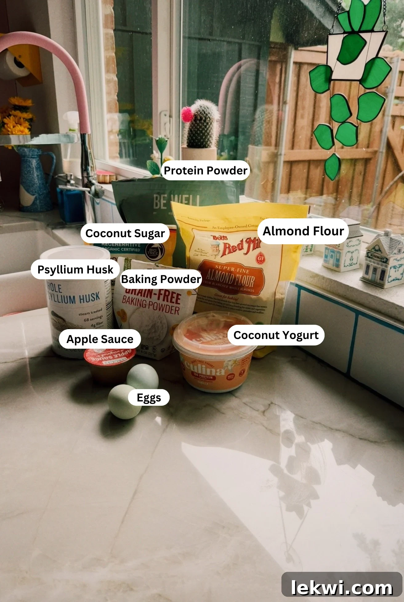 The ingredients to make high protein muffins on a counter before baking begins.